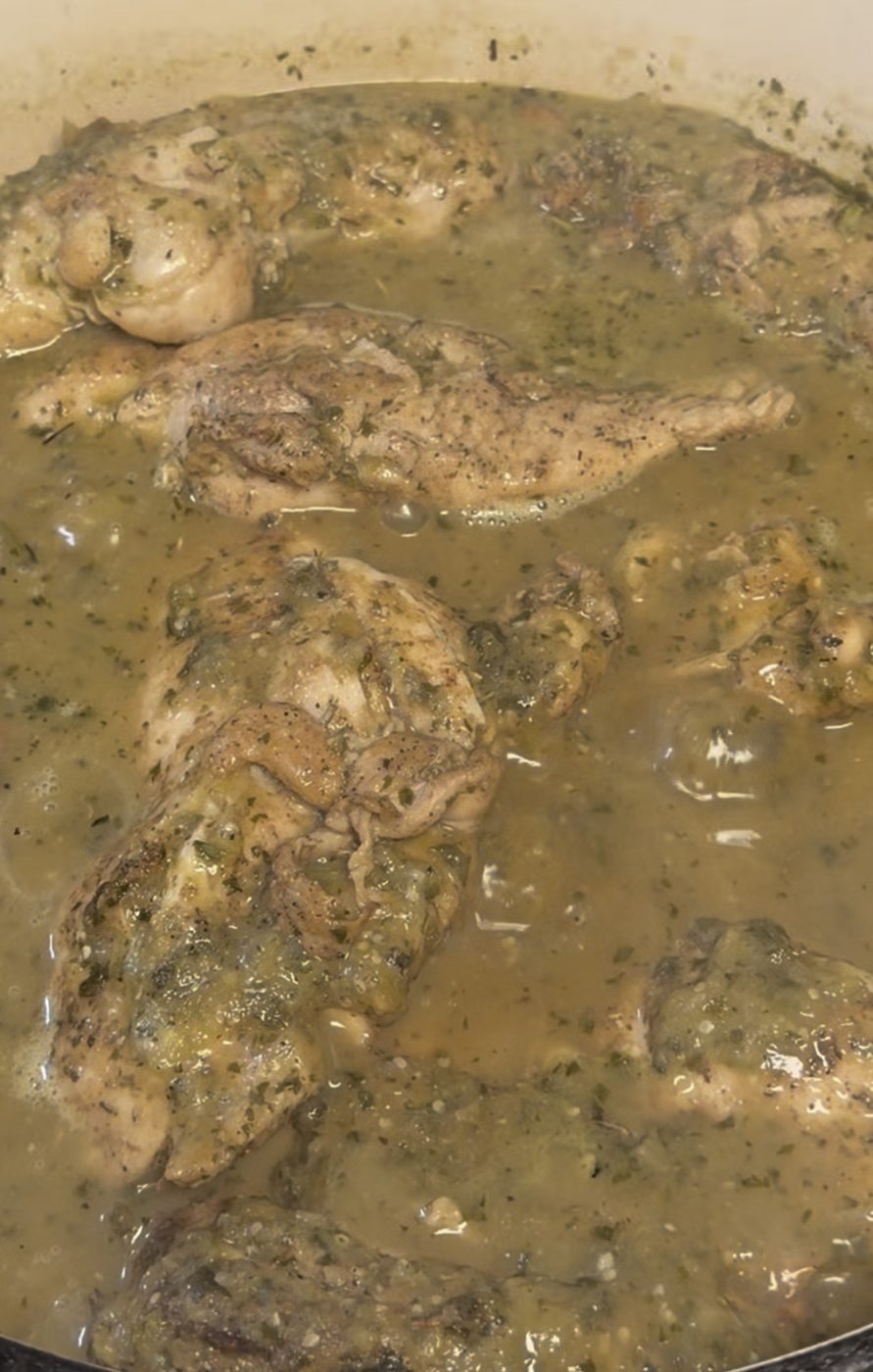Salsa verde chicken simmering in the pot